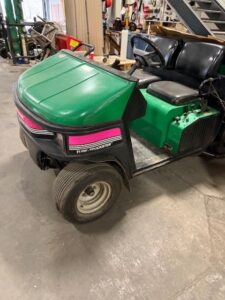 CUSHMAN TURF TRUCKSTER WITH TURFCO TOP DRESSER